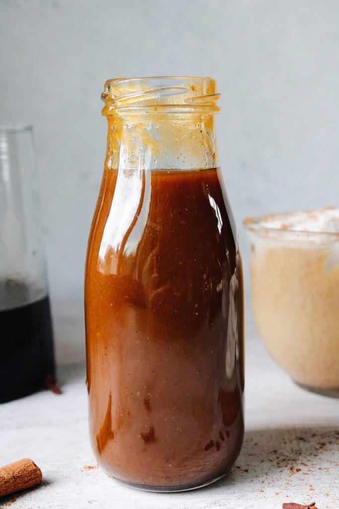 pumpkin spice simple syrup in a clear glass bottle