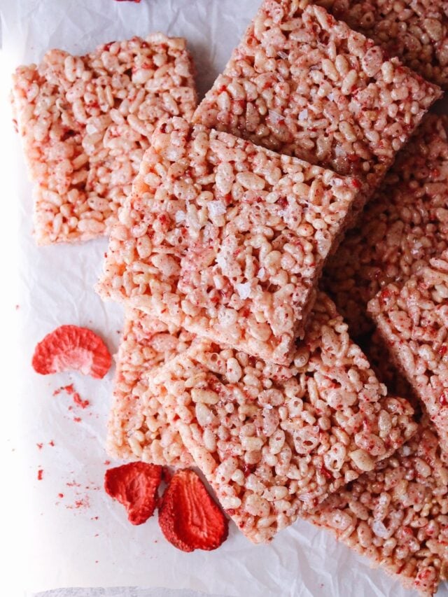 strawberry rice krispie treats on a white piece of parchment paper