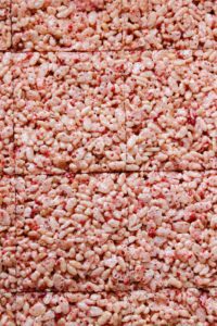 cooled strawberry rice krispie treats cut into bars