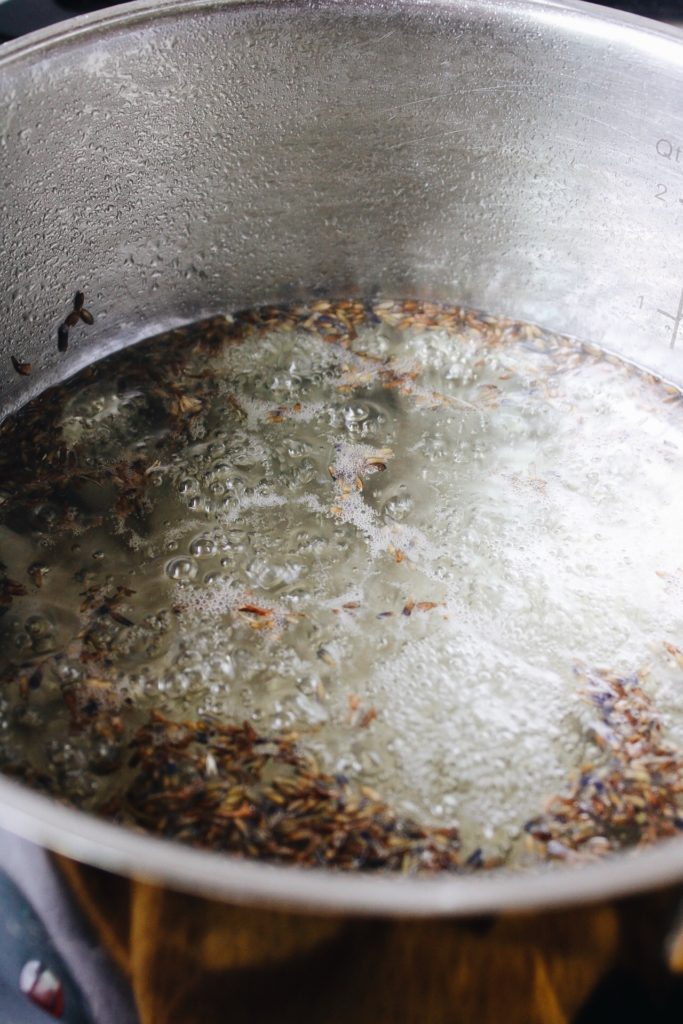 lavender simple syrup boiling in a stock pot