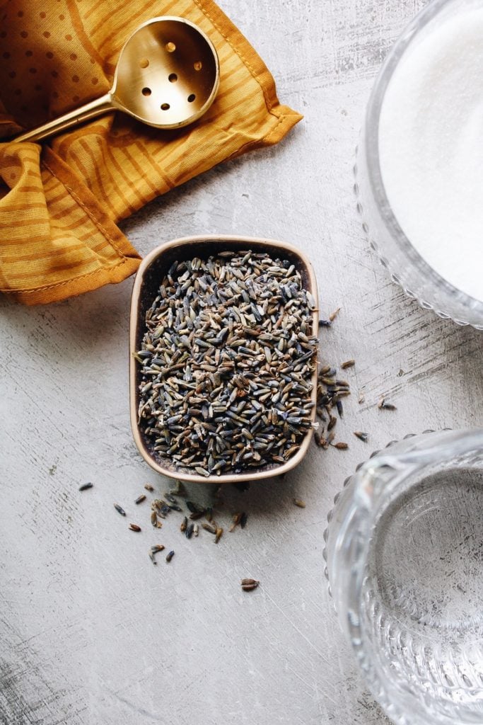 small dish with lavender, cup of milk and water