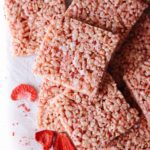 strawberry rice krispie treats on a white piece of parchment paper