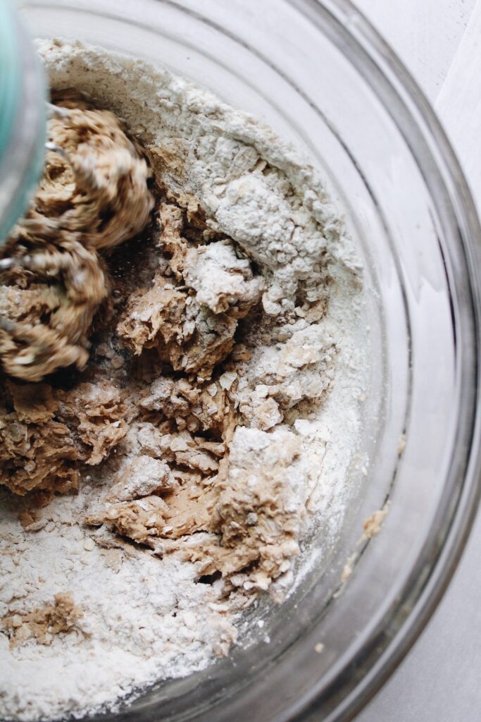 dry ingredients being beat into cookie dough