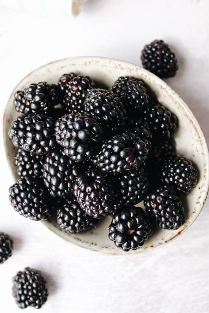 fresh blackberries in a white bowl