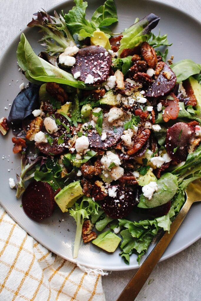 beet and avocado salad on a gray plate