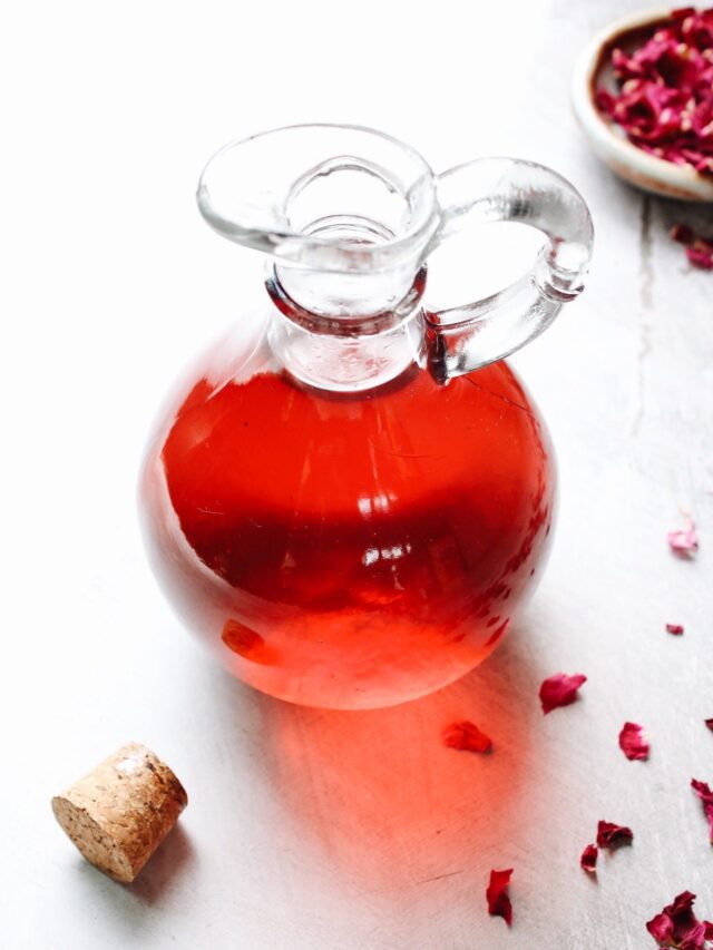 rose simple syrup stored in a glass jar