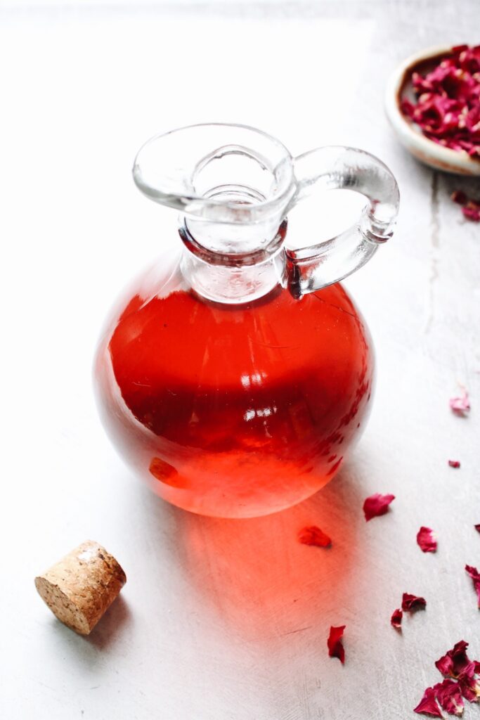 rose simple syrup stored in a glass jar