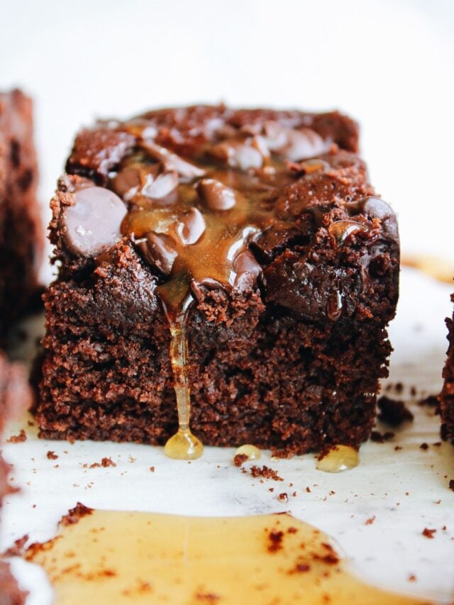 close up of honey brownies with honey dripping down the front