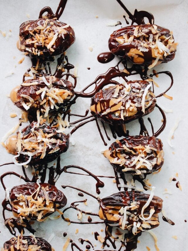 peanut butter stuffed dates drizzled with chocolate and sprinkled with toasted coconut
