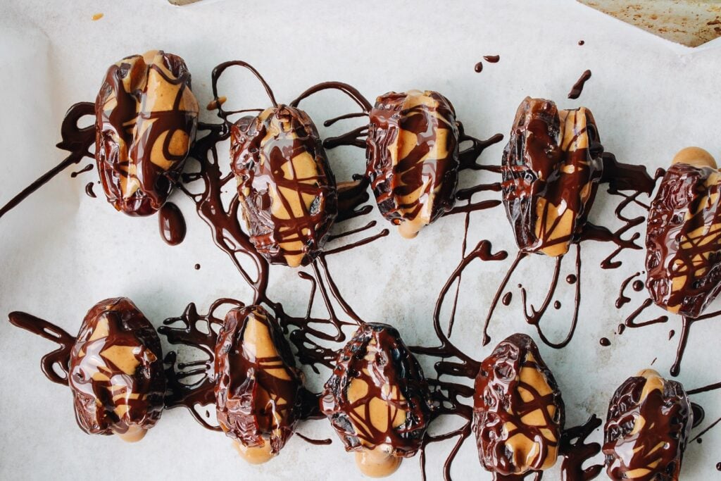 peanut butter stuffed dates drizzled with melted dark chocolate