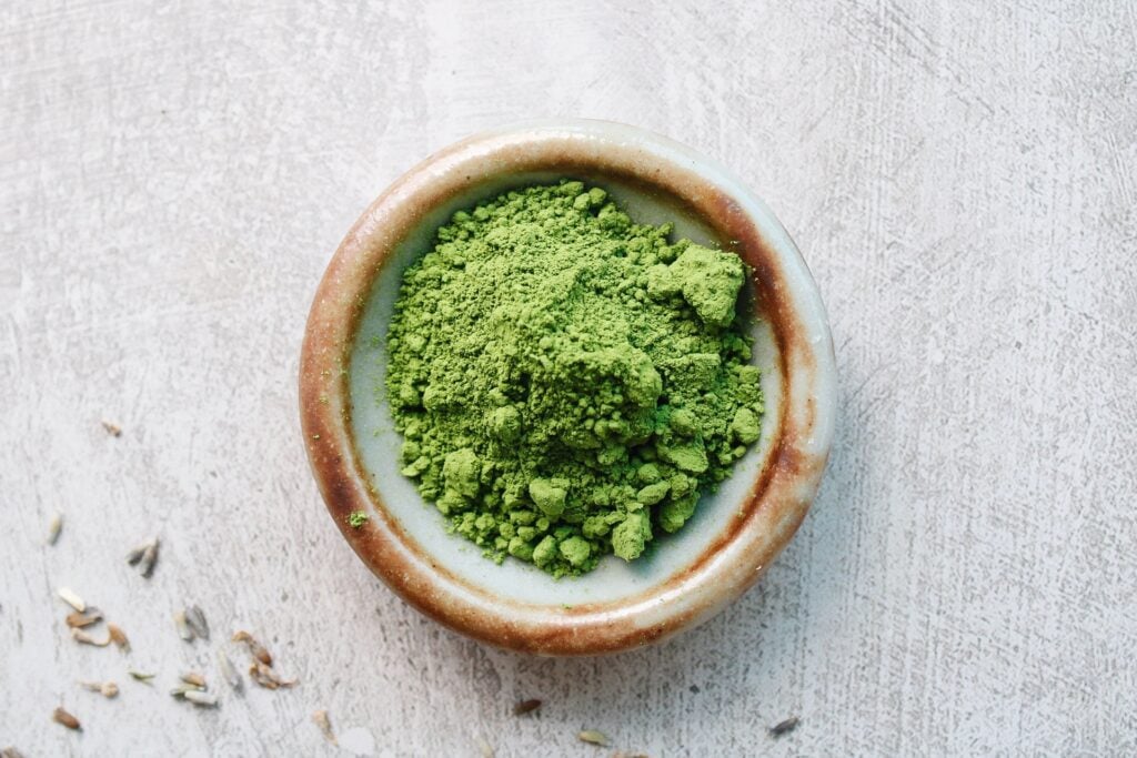 ceremonial grade matcha powder in a small dish