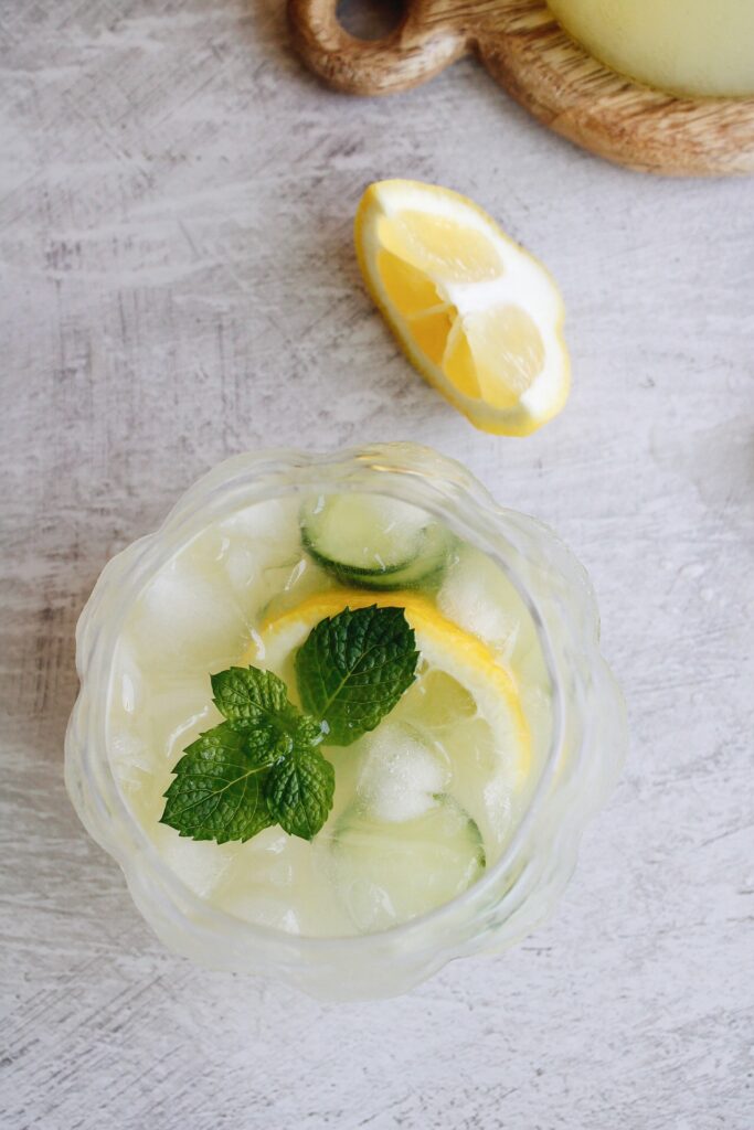 cucumber lemonade in a glass garnished with fresh mint