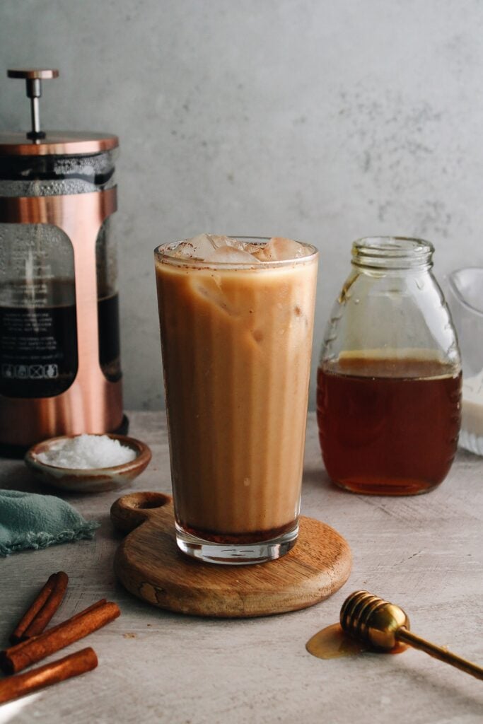 iced cinnamon honey latte in clear glass