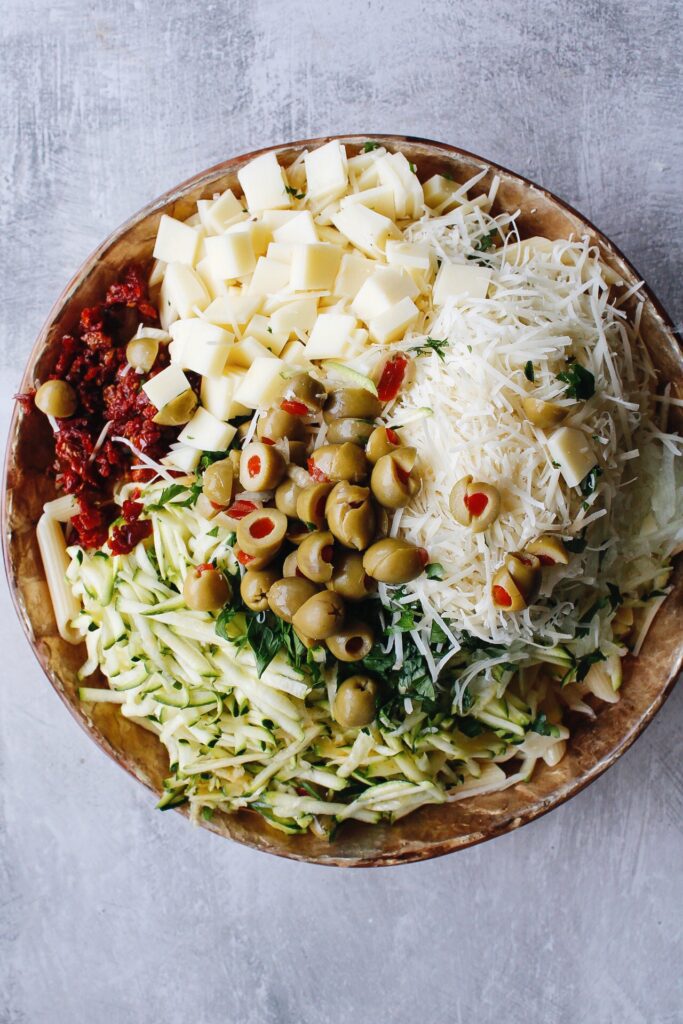 pasta salad ingredients in mixing bowl