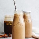 pumpkin spice iced coffee in glass bottles