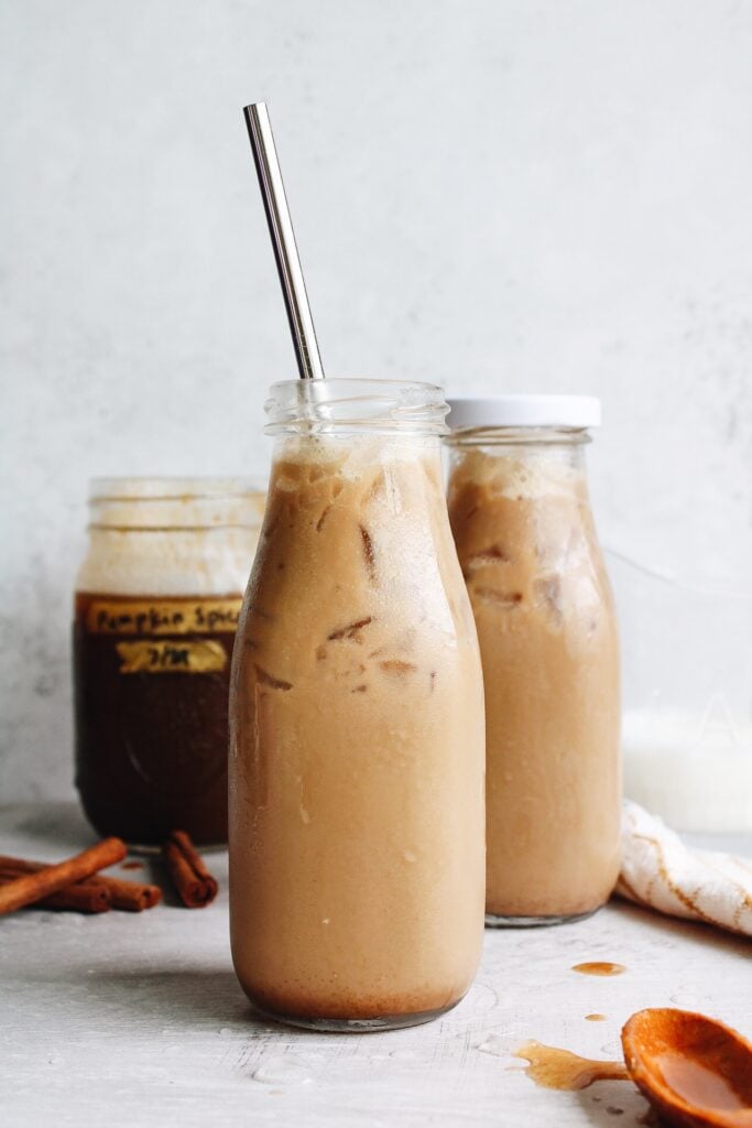 pumpkin spice iced coffee in glass bottles