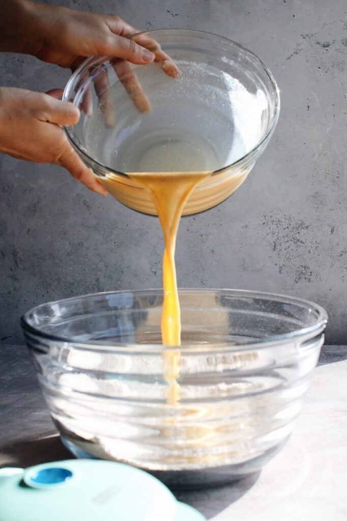 wet ingredients being added to dry