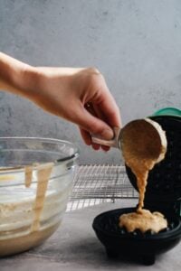 waffle batter being added to waffle maker