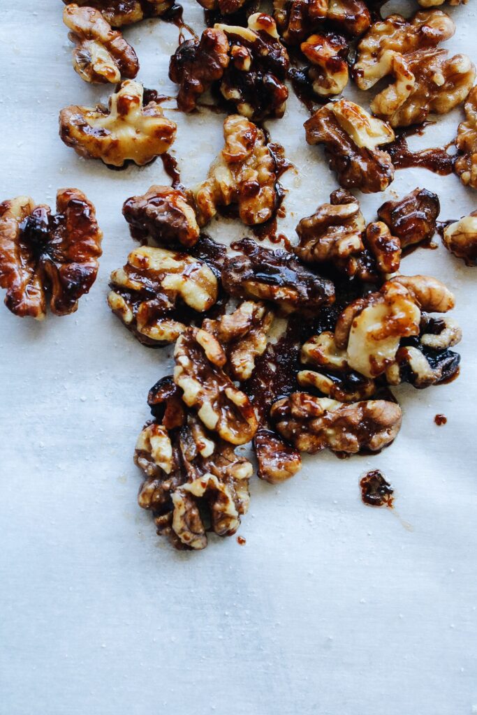 candied walnuts on parchment paper