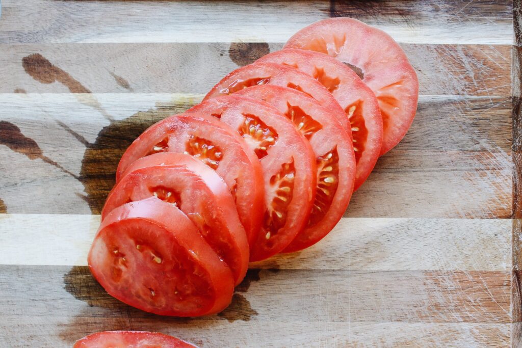sliced tomatoes on a cutting board