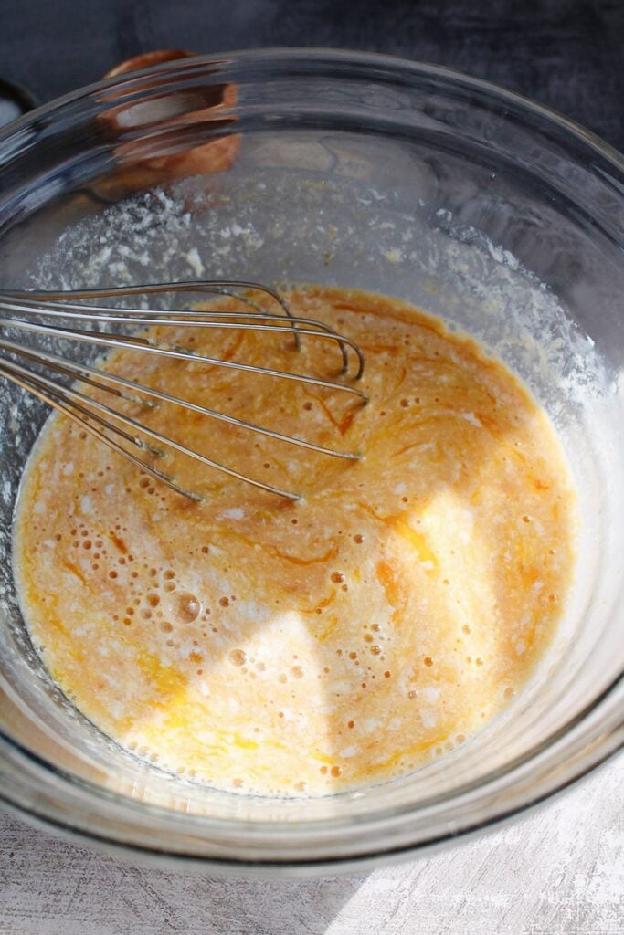 wet ingredients whisked in a clear bowl