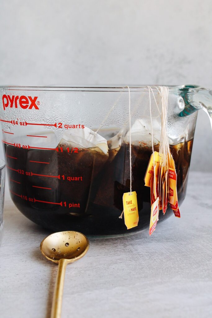 lipton tea bags steeping in a large pyrex liquid measuring cup
