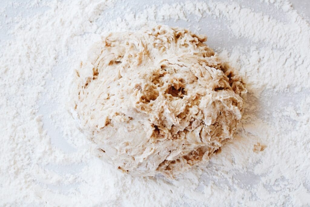 pizza dough turned out onto a floured work surface