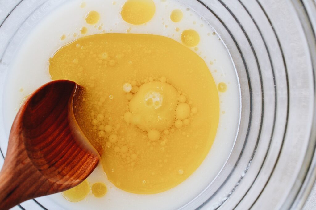 olive oil added to warm water with yeast and sugar