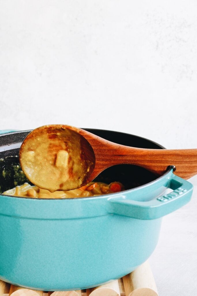 staub dutch oven with jonathans wooden spoon attached to the side