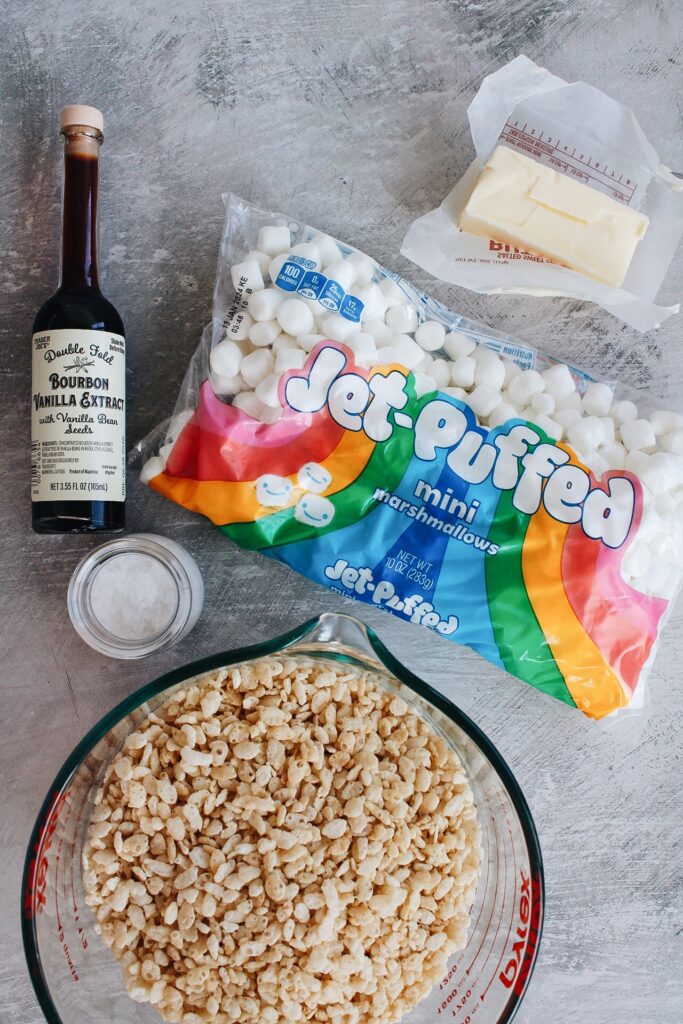 ingredients for brown butter rice krispie treats laid out on a gray table