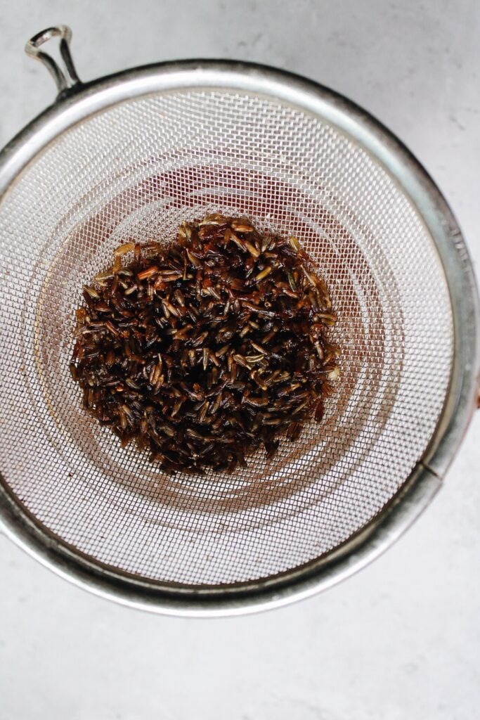 honey lavender syrup strained through a mesh sieve