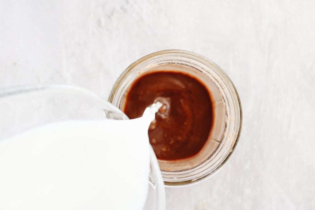 milk being poured into peppermint mocha mixture