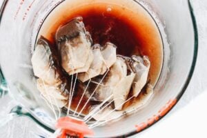 black tea bags steeping in hot water