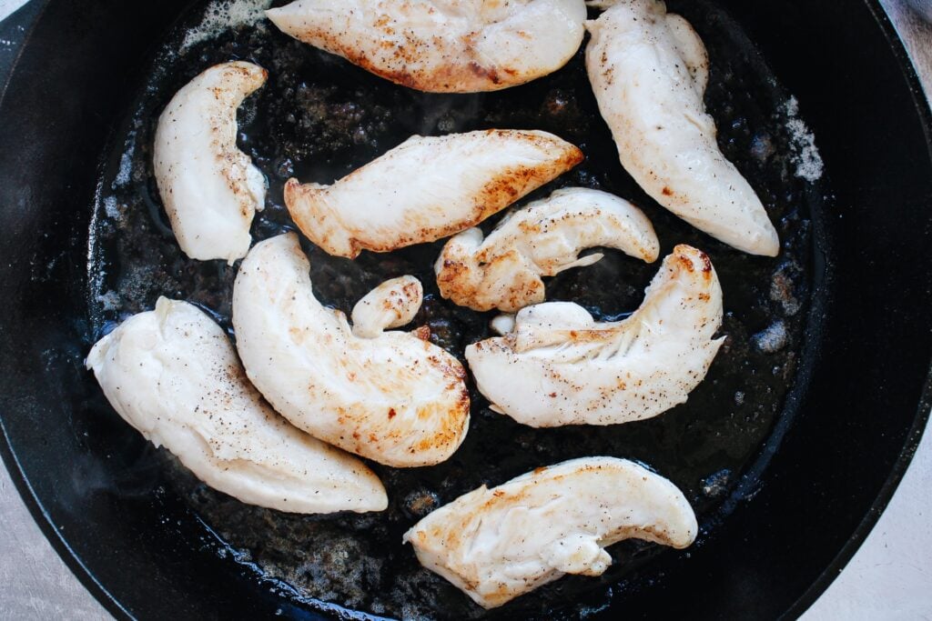 chicken tenderloins in a skillet