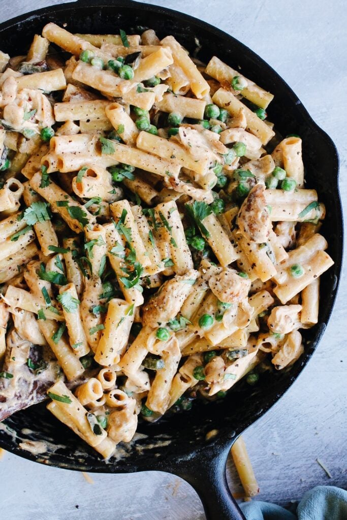 creamy chipotle chicken topped with cilantro and cracked black pepper for serving