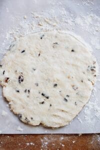 date scone dough flattened into a disc shape