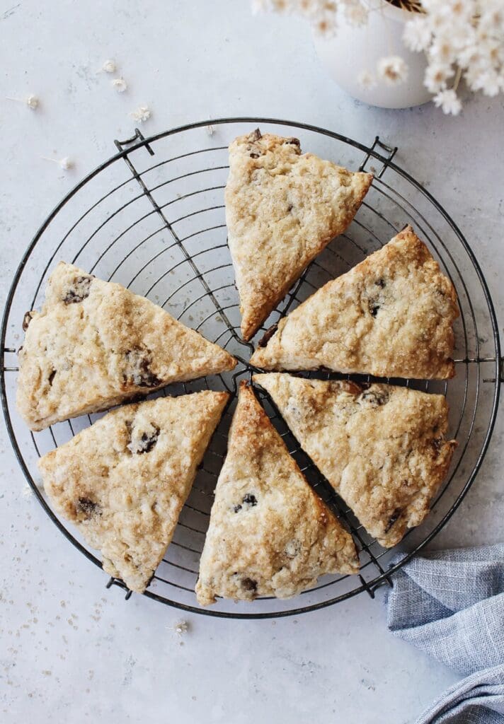 date scones on an antique baking rack with a blue napkin to the side