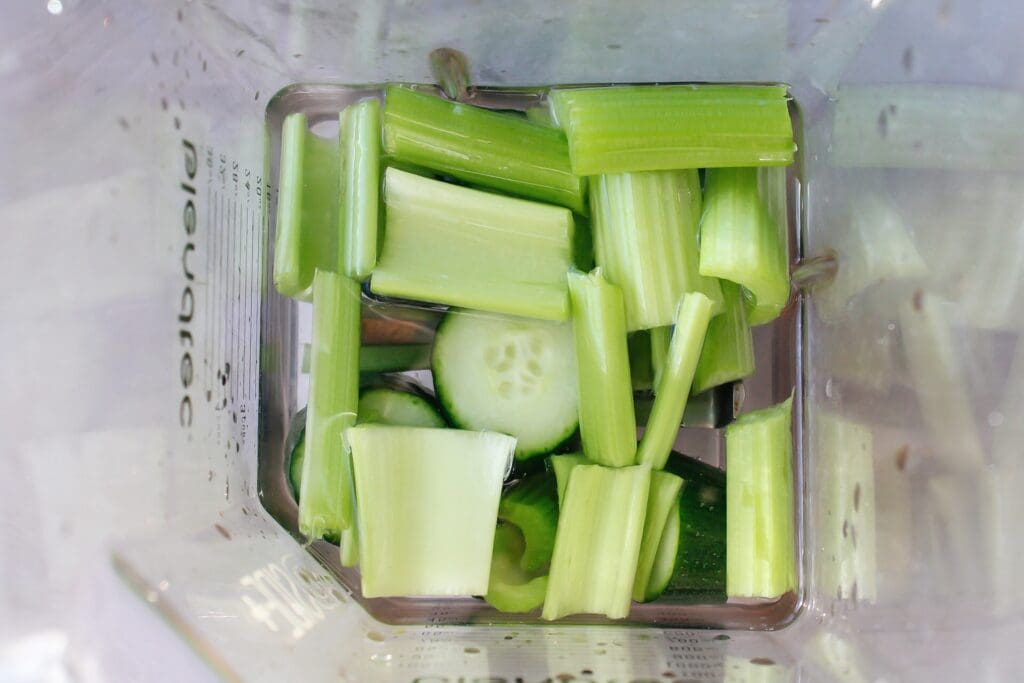 celery, cucumber, water and lemon juice in a blender