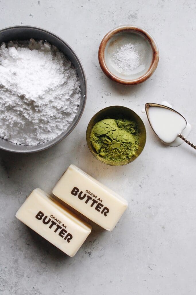 ingredients for matcha frosting on a gray countertop