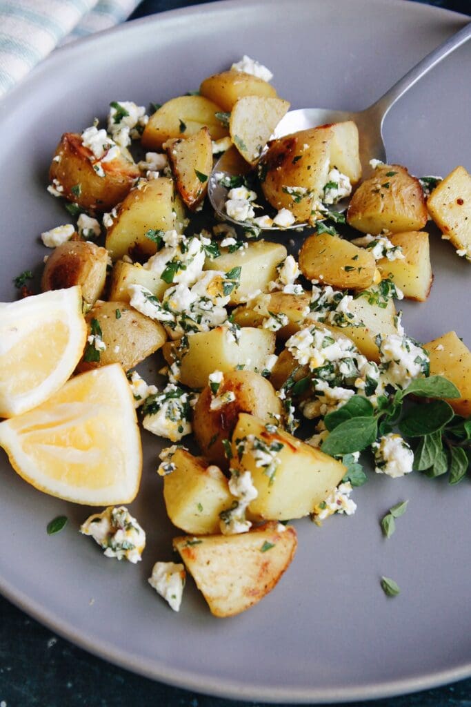 mediterranean potatoes with lemons on a gray plate
