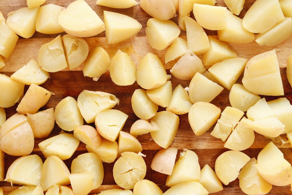 gold potatoes that have been microwaved and cut into small pieces