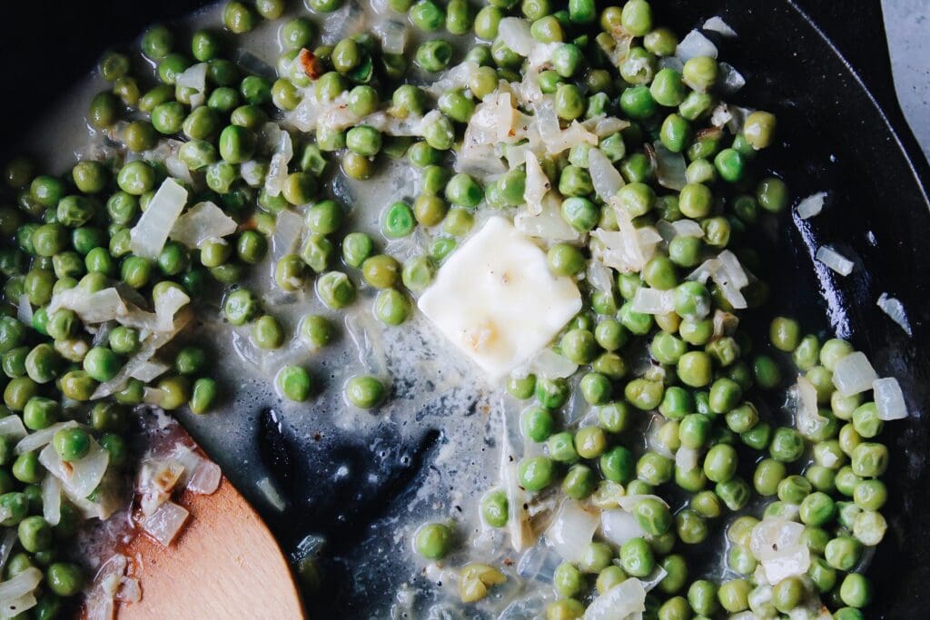 peas, butter and parmesan in a cast-iron skillet