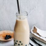 vanilla milk tea in a glass bottle with boba