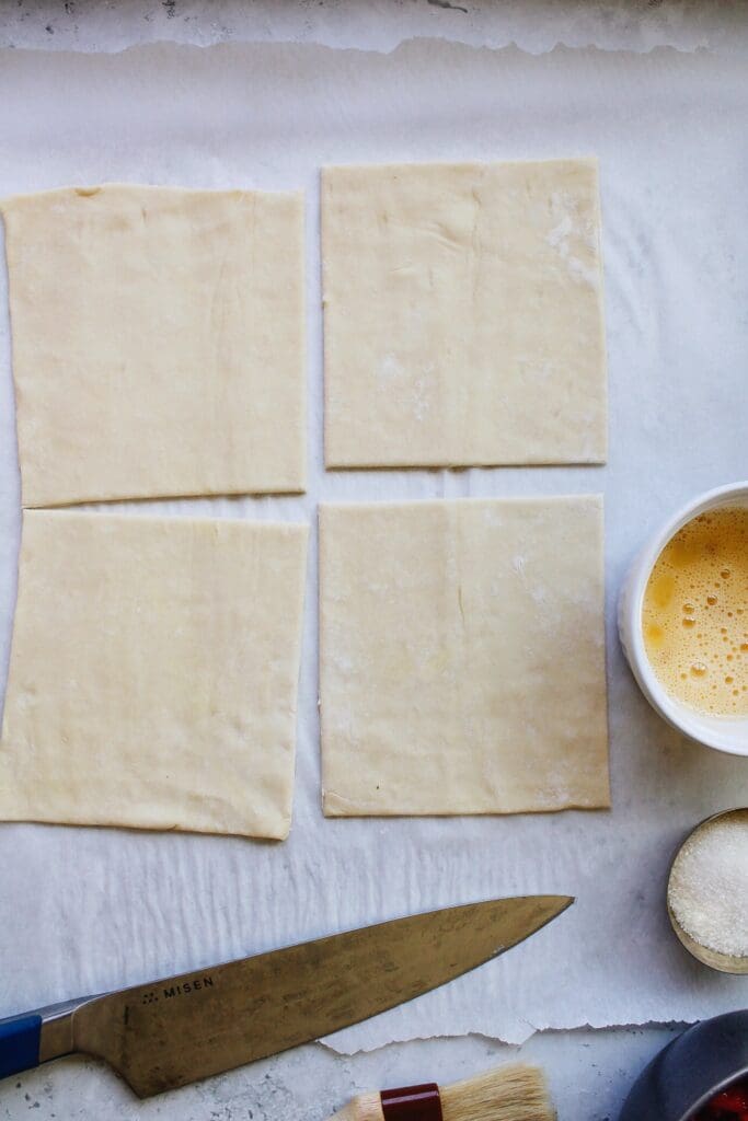 squares of puff pastry on a white background