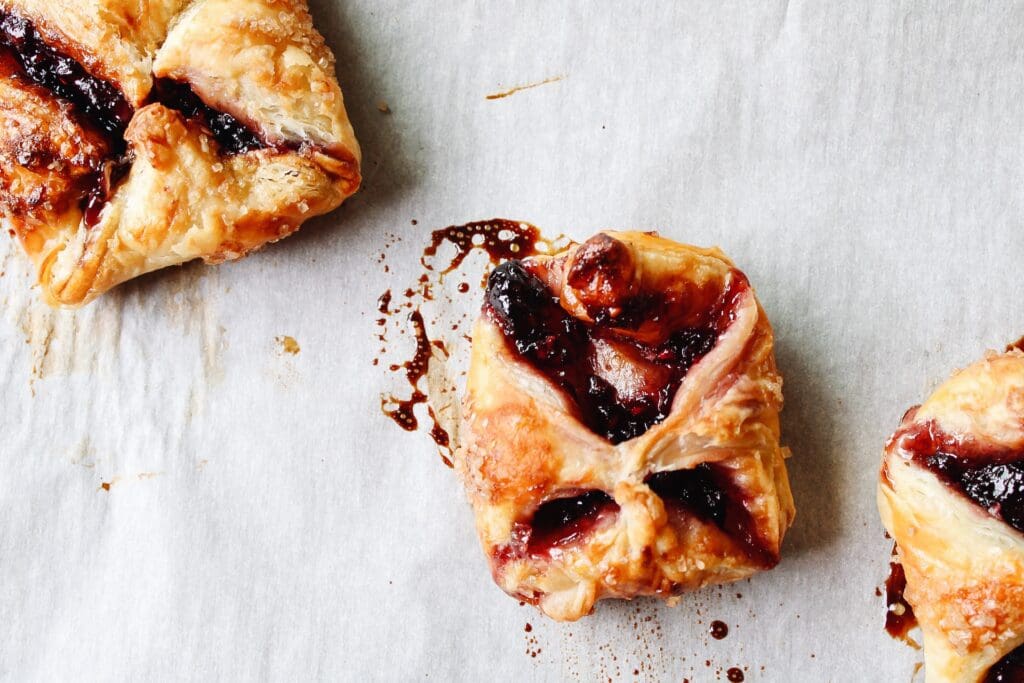 JAM PUFF PASTRY TART THAT HAS POPPED OPEN