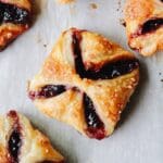 jam puff pastry tarts on parchment paper