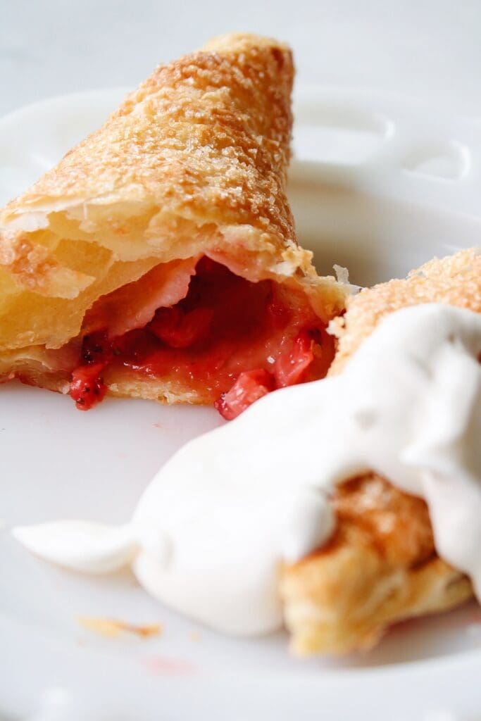 strawberry puff pastry turnover served with fresh whipped cream