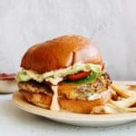 southwest chicken burger on a plate with french fries