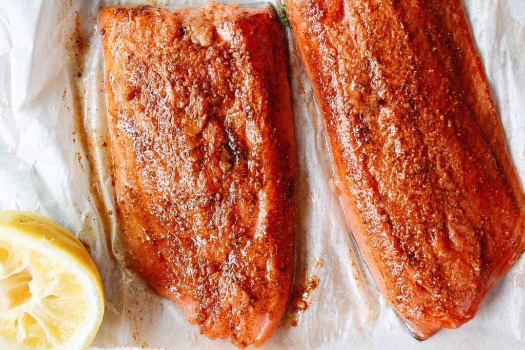 salmon fillets with spice rub applied