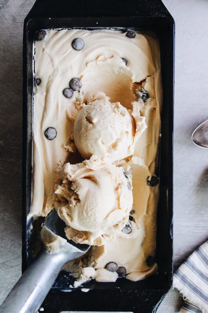 milk tea boba ice cream in a 9x 5 loaf pan with two scoops on top